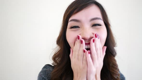 Business woman laughing look at camera.