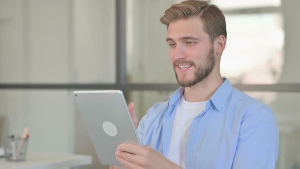 Portrait of Video Call on Tablet By Young Creative Man