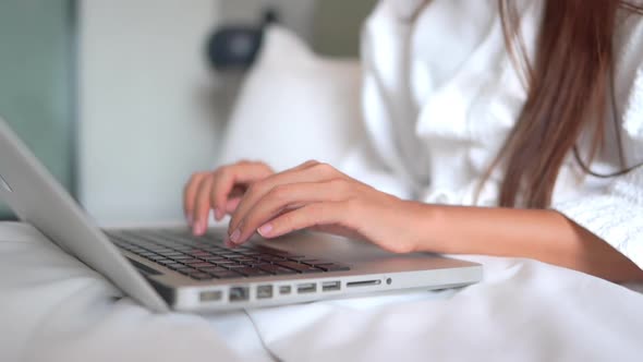 Young asian woman use laptop