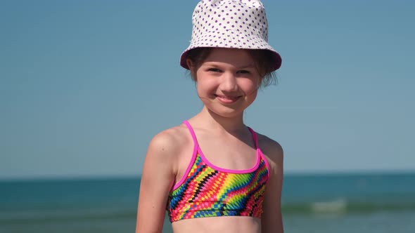 Happy Little Girl on Sea Background