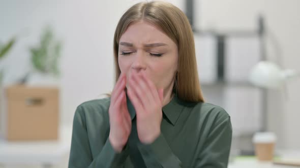 Portrait of Sick Young Woman Sneezing 