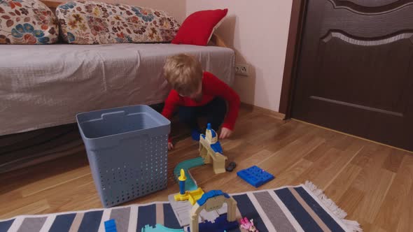 A Boy Plays Toy Car Road