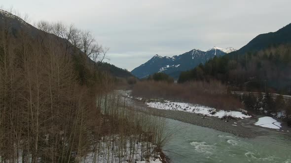 Aerial View of Chilliwack River with Snow During Winter Season