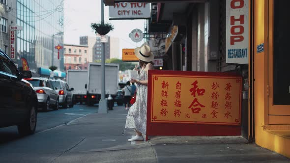 Young girl with a box of noodles