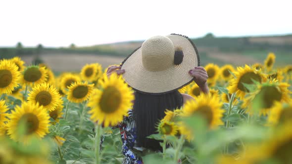 Woman in Hat Walking From Behind