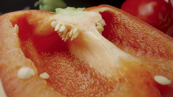 Sliced Half of Fresh Raw Red Bell Peppers on Wooden Board