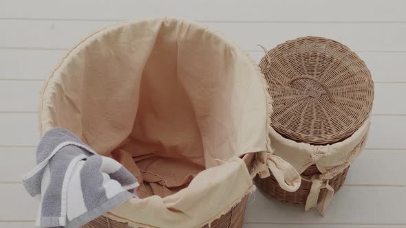 Top View  Stop Motion of Dirty Clothes are Filling Into a Laundry Basket on a Floor