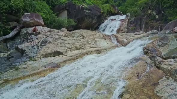 Camera Shows Cold Water Waterfall Cascade Flowing on Rocks