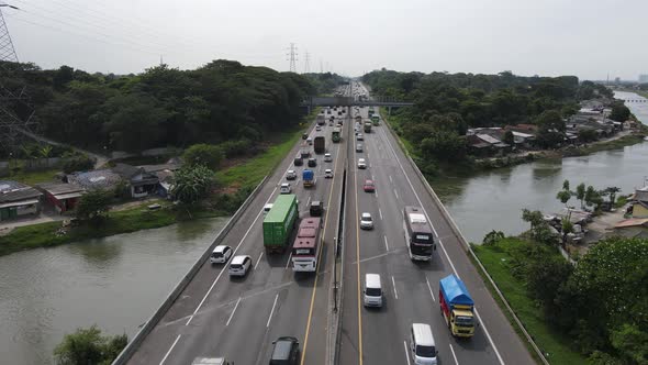 Aerial view of Indonesia Highway with busy traffic.