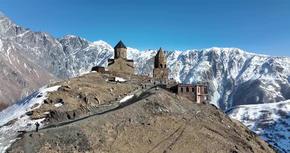 Aerial view of Gergeti Trinity Church, Tsminda Sameba in Kazbegi. Georgia 2022