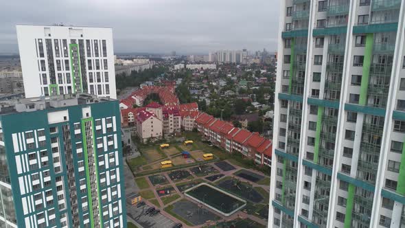 Aerial view of new modern, colorful, high-rise buildings with playground 12