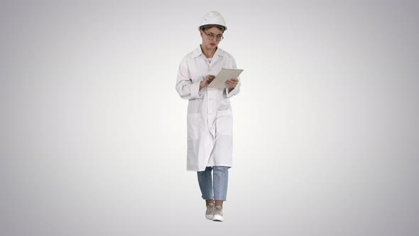 Woman Engineer Working on Tablet on Gradient Background. alt