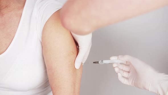 Closeup Shot of a Needle Sticking in the Arm of a Caucasian Patient