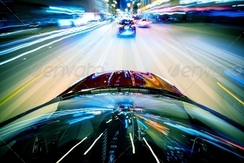 Illumination in Motion Blur. City Streets Speeding Car.