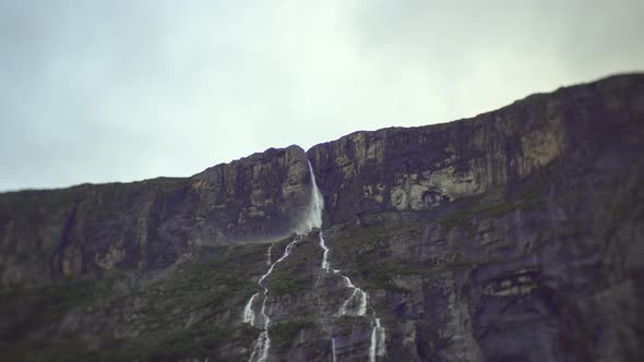 Huge, Beautiful waterfall coming down a big mountain in Norway, Europe. 4K.