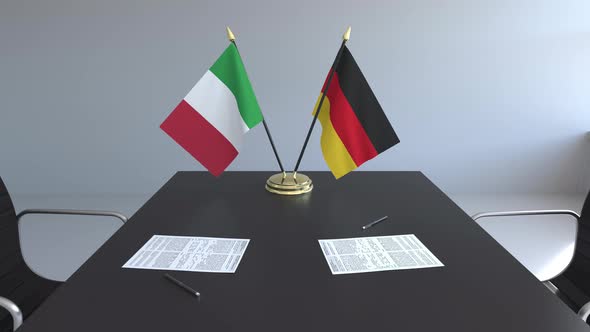 Flags of Italy and Germany on the Table