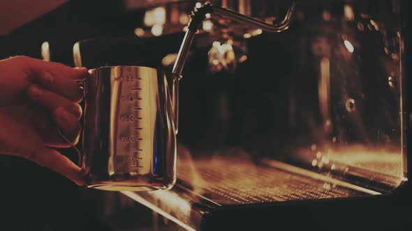 Barista Prepares Milk for Cappuccino