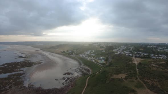 Drone aerial footage of the rocky cliffs of Beauport Beach in Jersey.