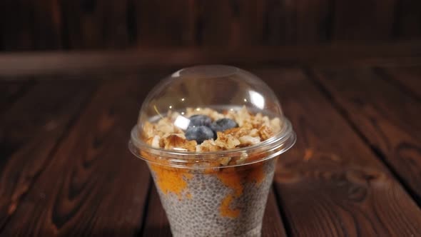 Healthy Dessert with Chia Seeds Blueberries and Nuts Closeup on the Table