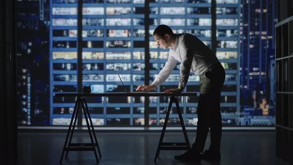 Confident Manager Working Late Night in Office