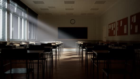 Rays of light falling to the empty classroom. Abandoned school. Disturbing mood