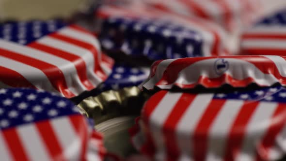 Rotating shot of bottle caps with the American flag printed on them - BOTTLE CAPS