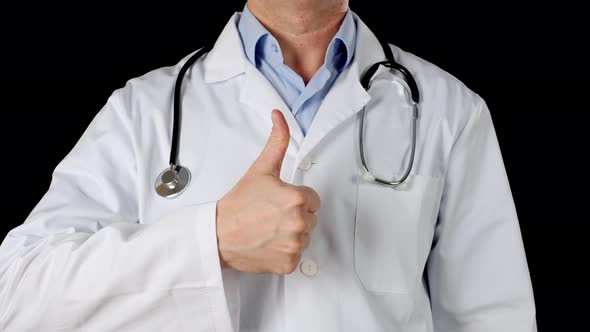 Male Doctor Hand Showing Thumbs Up on Medical Gown and Stethoscope Background. Close Up Doctor