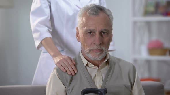 Kind Female Nurse Supporting Pensioner, Quality Service in Home for Elderly