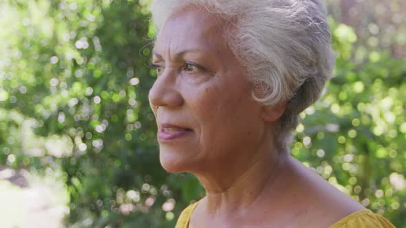 Senior mixed race woman smiling and looking at the camera