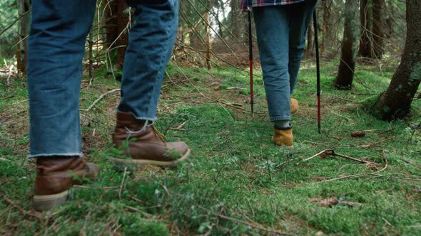 Man and Woman in Hiking Boots Walking in Woods