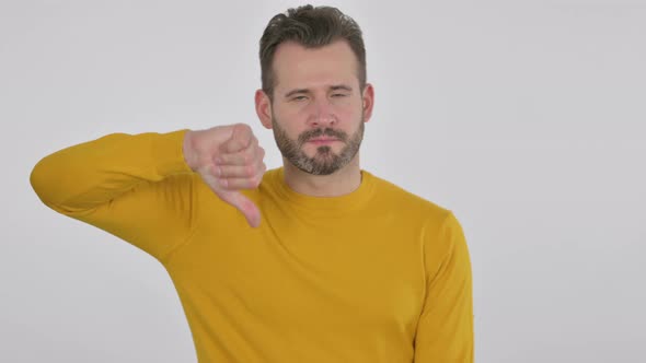 Portrait of Middle Aged Man Showing Thumbs Down Gesture