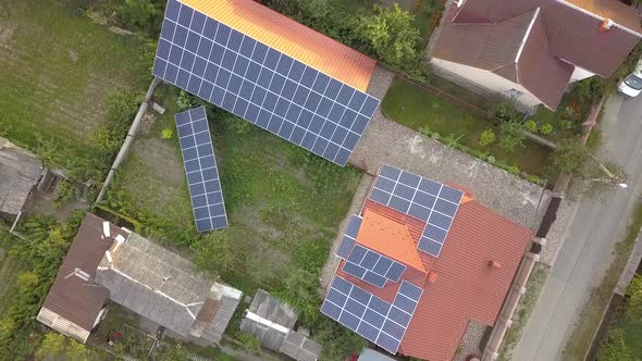 Aerial view of a private house with solar panels on roof. Photo voltaic system for renewable energy