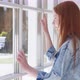 Teenage Girl Looks Out Window with Curiosity - VideoHive Item for Sale