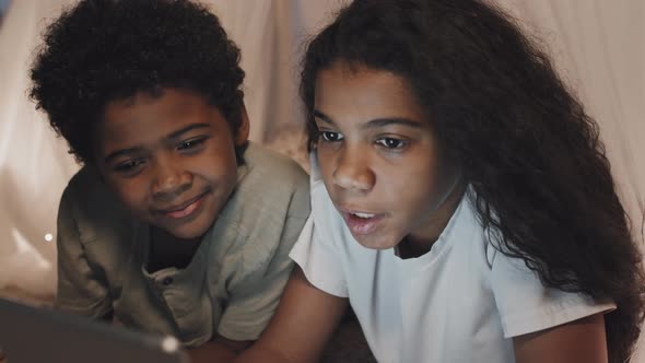 Kids Using Tablet in Handmade Tent