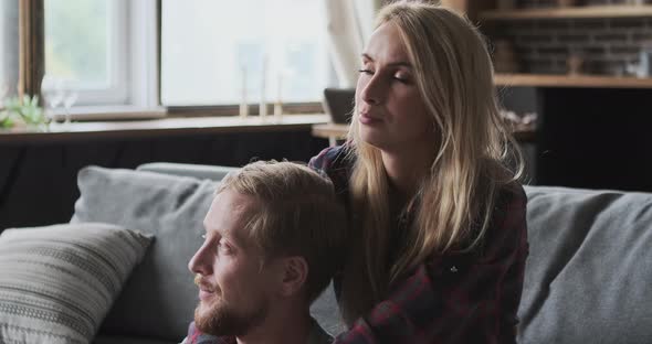 Happy European Husband and Wife Hugging Talking News Discussing Interesting Dialogue at Home