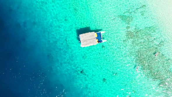 Aerial drone view nature of tropical island beach holiday by clear lagoon and white sand background 