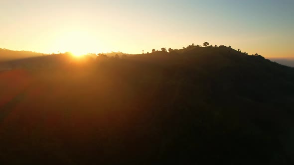 4K Flying through the clouds above mountain tops