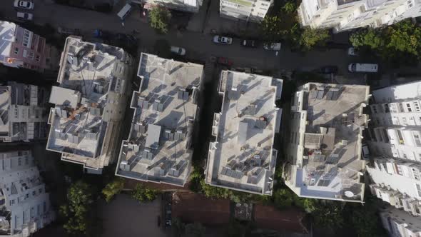 Top View of Apartment Buildings Roofs with Solar Panels