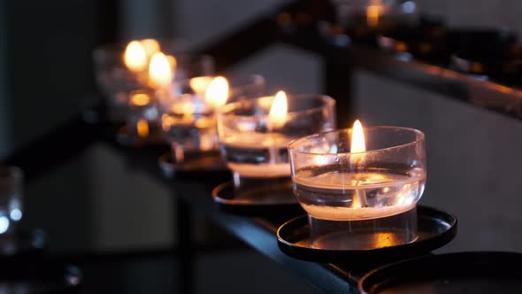 Burning Candles Inside Church Interior Prayer Candles Lit in Row Spirituality