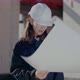 Young Female Architect Analyzing Blueprint at Site - VideoHive Item for Sale