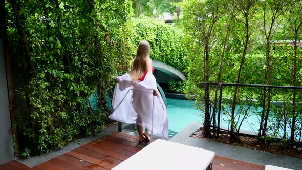 Travel Female on Vacation in Holiday Villa with Terrace Green Tropical Trees