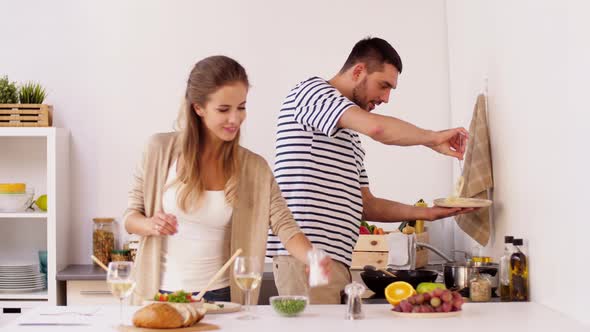 Happy Couple Cooking and Serving Food at Home 19