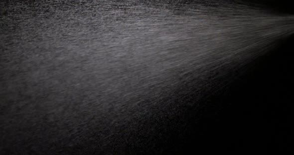 Water Spray Against Black Background