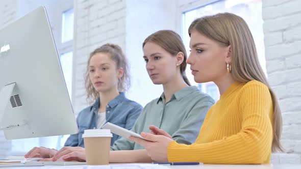 Serious Creative Female Designers Looking at the Camera