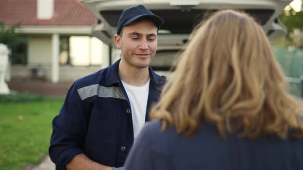 Woman Meets a Handsome Friendly Delivery Man Who Gives Her a Parcel Box Beside Her Home