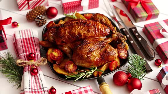Roasted Whole Chicken or Turkey Served in Iron Pan with Christmas Decoration