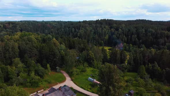 Old Wooden Houses Built for Paper Mill Workers in Ligatne. Wooden Row House 4K Aerial Shot	