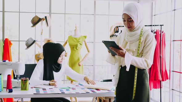 Muslim women fashion designers are in process of creating new clothes collection.