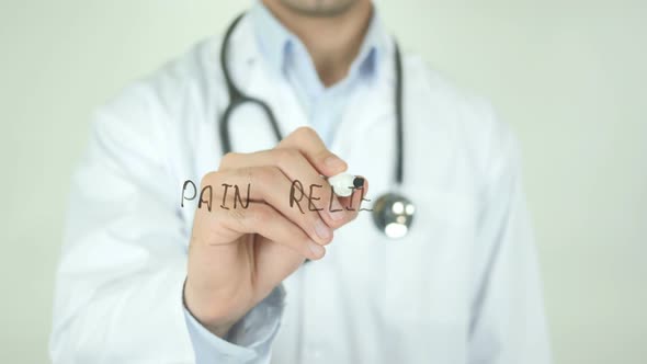 Pain Relief, Doctor Writing on Transparent Screen