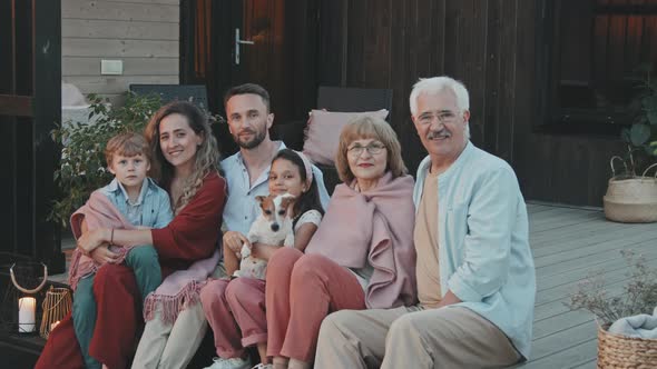 Big Family Sitting on Porch Portrait